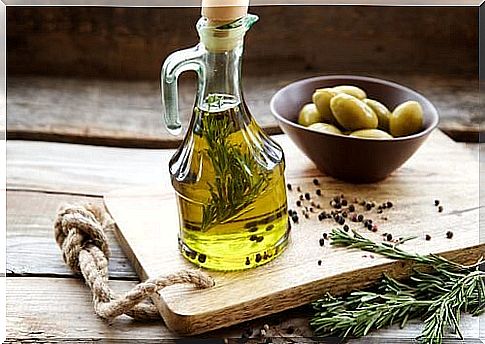 Olive oil on a tray with olives