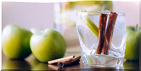 cinnamon and apple in a glass