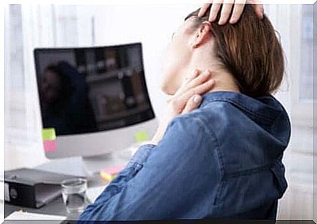 A woman who works and suffers from neck pain. 