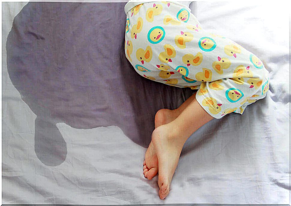 A child who has wet the bed and is affected by urinary incontinence